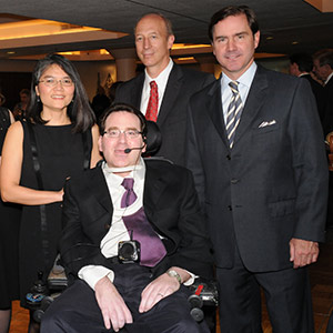 Jason S. Goldfeder, MD, is flanked by (from left) his wife, Nguyet Nguyen, MD; David Holtzman, MD, head of the Department of Neurology at Washington University; and Toby Martin, CEO of NAI DESCO, at the 2012 Evening of Hope, an event held by the organization Hope Happens for Neurological Disorders. Goldfeder was honored at the event with the Spirit of Hope Award. Photo: Reprinted with permission from L. Strauss / Ladue News