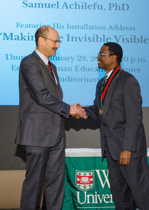 Perlmutter (left) congratulates Achilefu after Achilefu was named the inaugural Michel M. Ter-Pogossian Professor of Radiology.