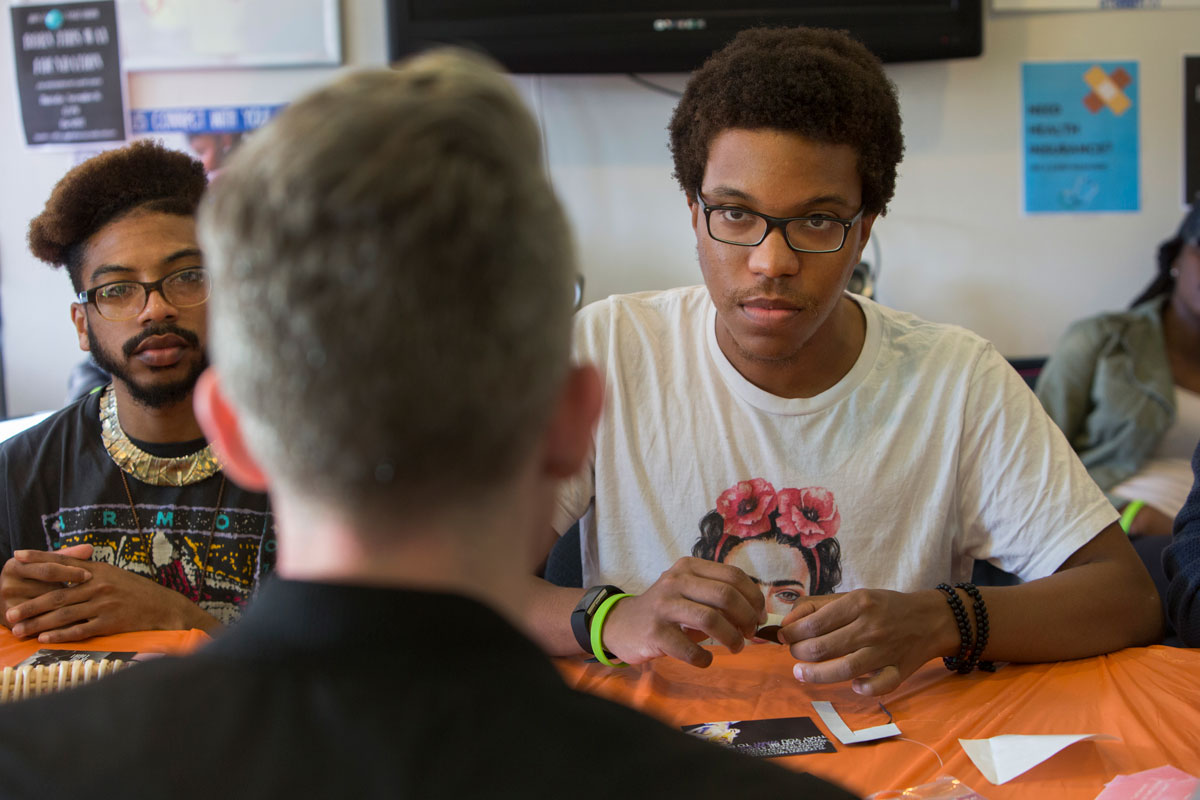 Jay Gaskin (left) and Patrick Easley (right) talk with Alex Aide, of Lady Gaga's Born This Way Foundation, about The SPOT.