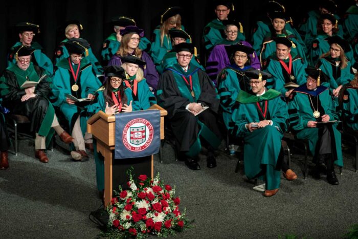 Dr. Hanna-Attisha on stage addressing graduates at MD Commencement