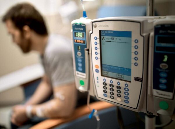 Brian Phillips, a patient with MS, receives an infusion of rituximab, a drug that depletes B cells and has been shown to slow the progression of the disease in certain patients.