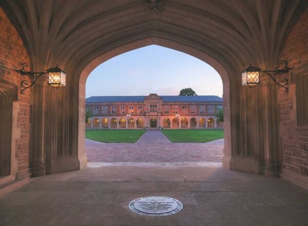 Photo shot through gothic stone archway on WashU's Danforth Campus