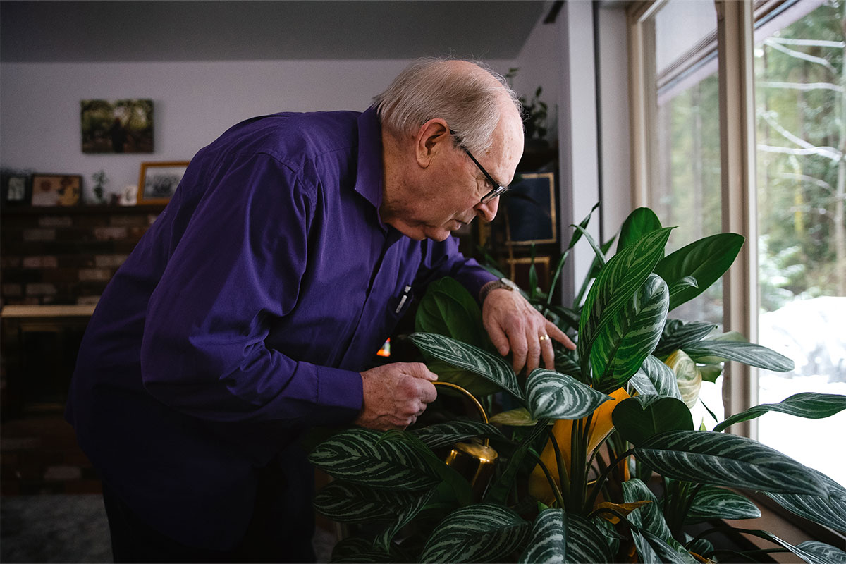 Man caring for plant