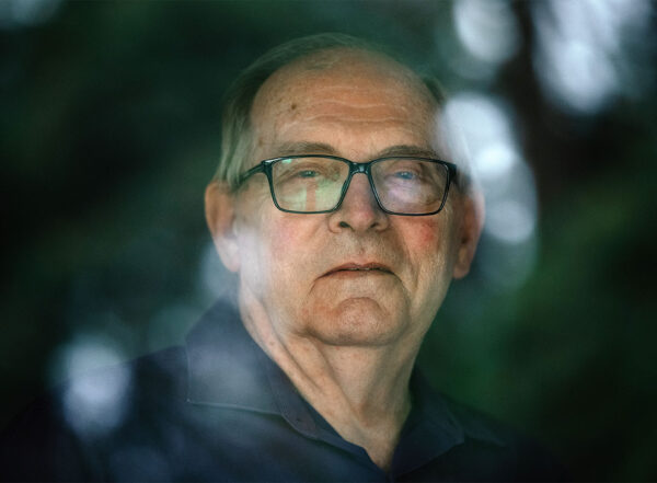 Man looking through a window