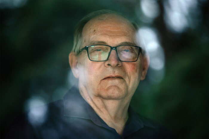 Man looking through a window