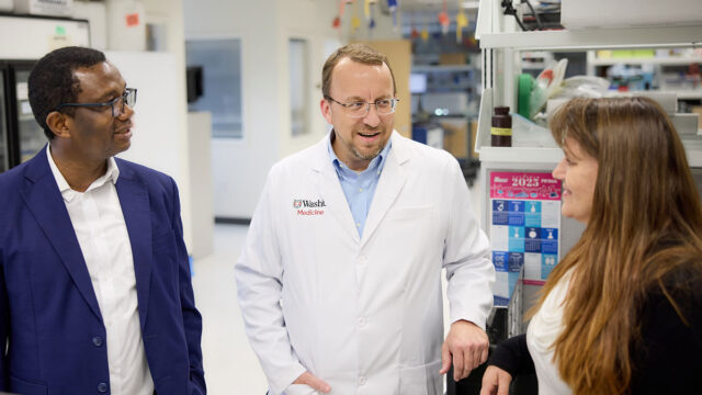 Infectious diseases professor Philip J. Budge, MD, PhD, talks with co-PIs on a recent project, Catherine Bjerum from Case Western and Benjamin Koudou from the Swiss Center for Scientific Research