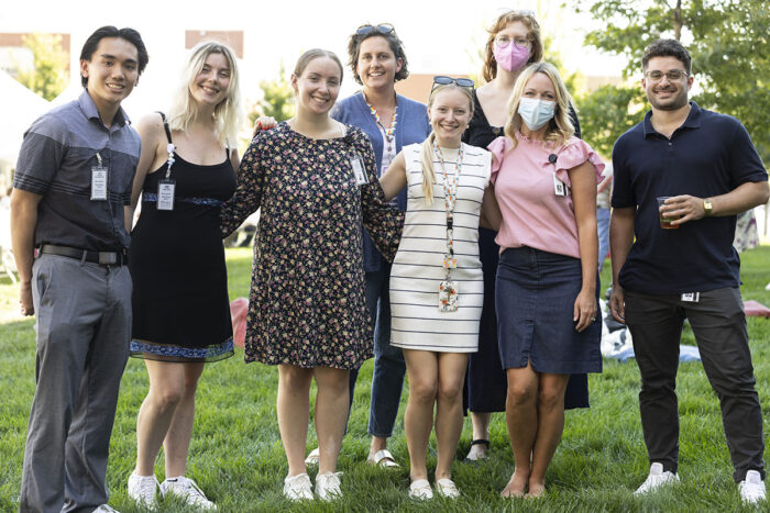 Eight staff members pose for photo