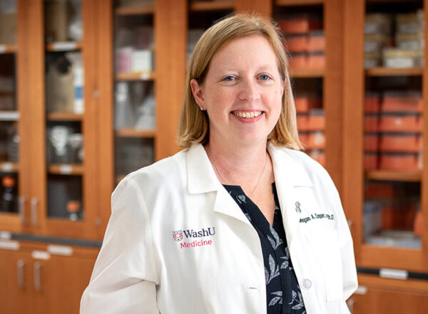 Megan Cooper poses in a lab