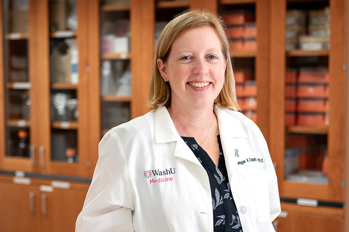 Megan Cooper poses in a lab