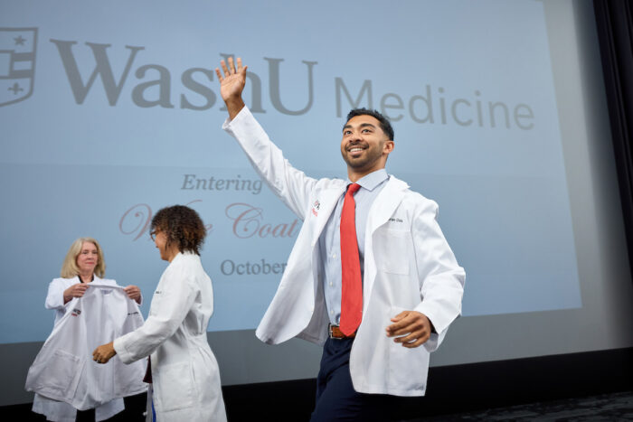 First-year medical student waving