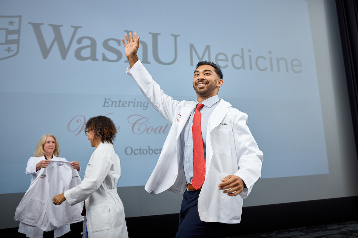 First-year medical student waving