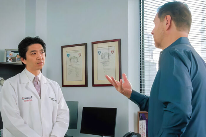 Dr. Kaneko listens to patient Christopher Bryant