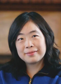 Woman with dark hair.