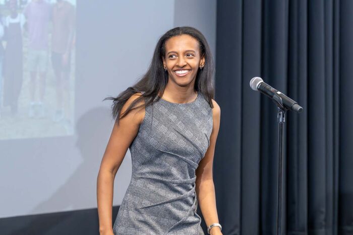 Medical student stands on stage during Match Day event
