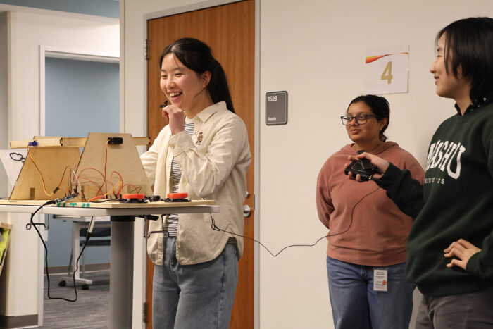 Three students present product