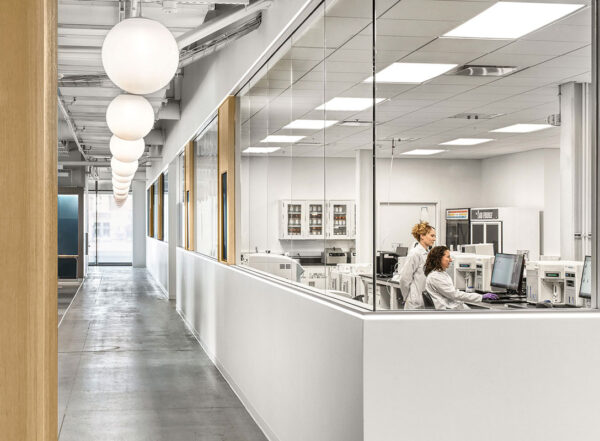 Photo of lab with two scientists at a computer.
