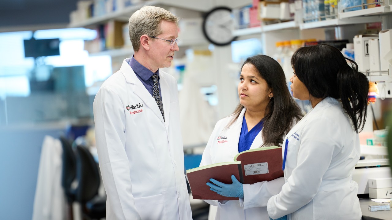 Timothy Miller, MD, PhD, collaborating in his lab