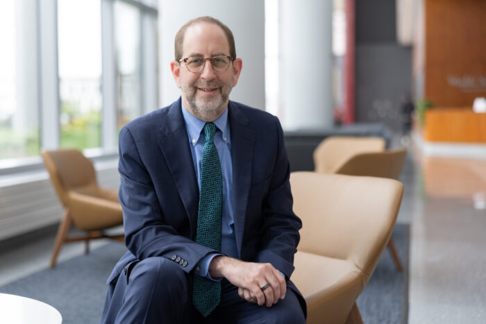 Dean Bruce D. Levy, MD seated in the Jeffrey T. Fort Neuroscience Research Building .