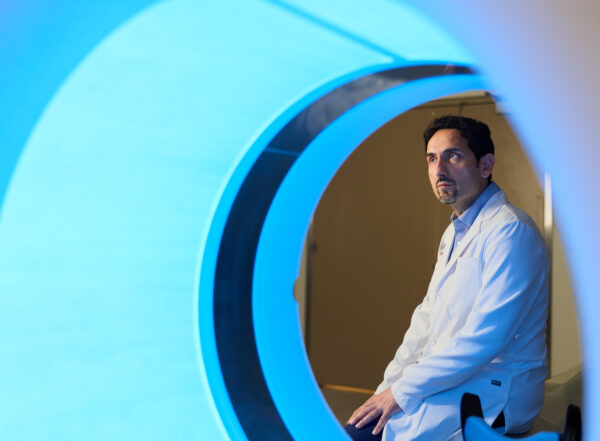 Man framed by CT scanner