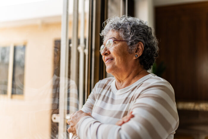 Senior woman contemplating at home