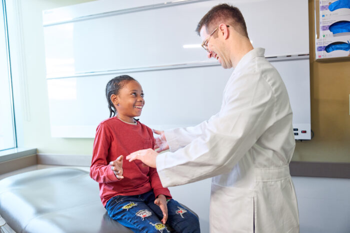 Jaylanie Lancello, 11, gets a checkup from David Clever, MD, PhD, at the Center for Advanced Medicine
