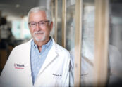 Man in white coat.