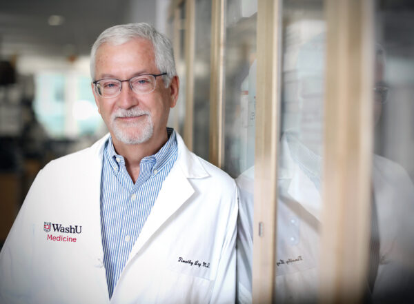 Man in white coat.