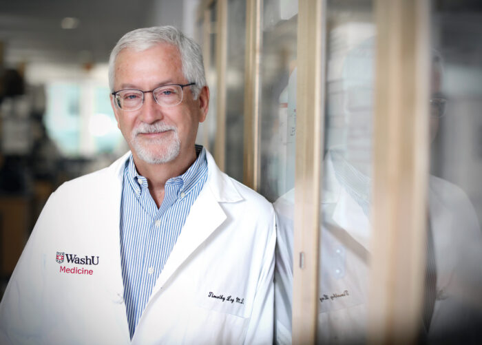 Man in white coat.