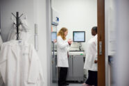 Suzanne Schindler, MD, PhD, reviews data from an assay analyzer with clinical lab assistant Alexis Montgomery regarding Alzheimer’s disease research at the Fort Labs at the Neuroscience Research Building on February 18, 2026.