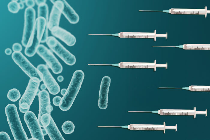 illustration of needles pointing at bacteria